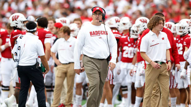 Wisconsin head coach Paul Chryst looking up at the video board against Washington State.